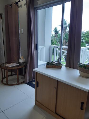 a kitchen with a counter and a large window at THE VIEW in Port Alfred