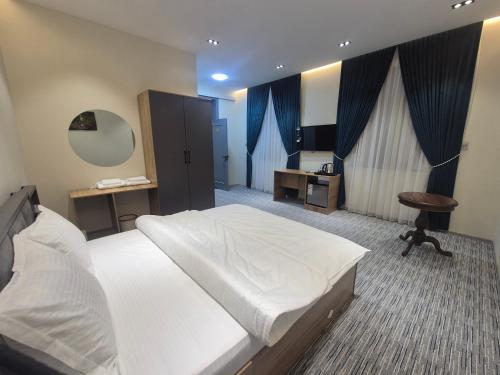 Ένα ή περισσότερα κρεβάτια σε δωμάτιο στο Shinam Hostel