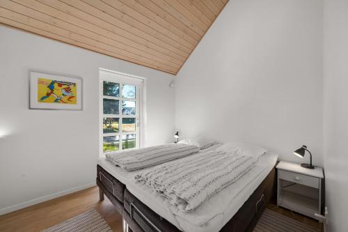 Postel nebo postele na pokoji v ubytování Feriehus 1150