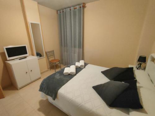 Ένα ή περισσότερα κρεβάτια σε δωμάτιο στο Acogedor Apartamento