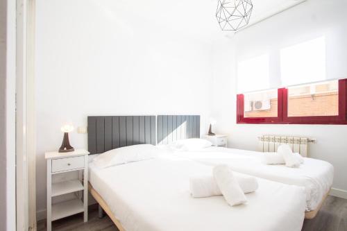 En eller flere senge i et værelse på Apartamento Green City Deco