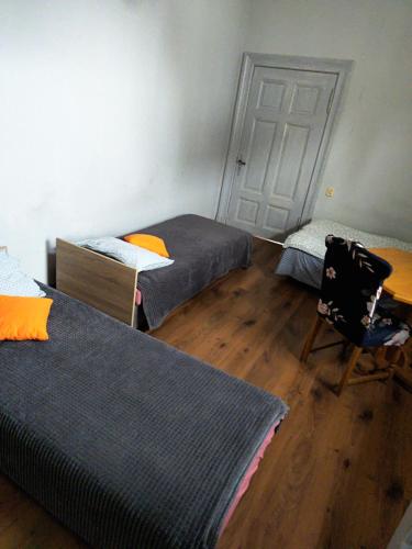 Postel nebo postele na pokoji v ubytování Hostel Staromiejski