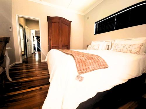 Postel nebo postele na pokoji v ubytování Arbour1 Guesthouse