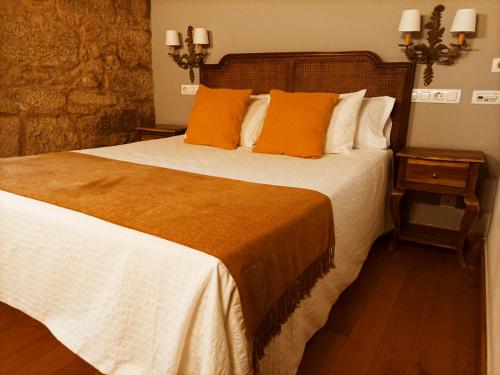 Postel nebo postele na pokoji v ubytování Vila As Pedras