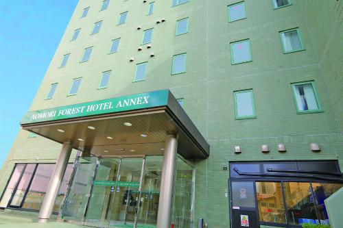a building with a sign that reads armour trust hotel emergency at 青森フォレストホテル アネックス in Aomori
