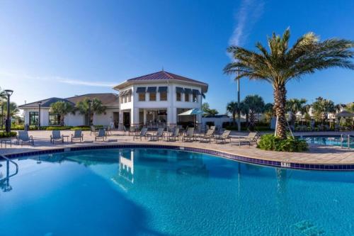 a swimming pool in front of a resort at 4 Bedrooms 3 Bathrooms Storey Lake 3195 Pp in Orlando