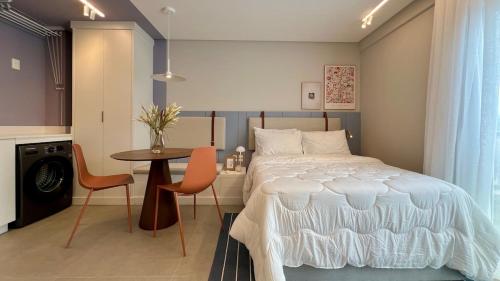 En eller flere senge i et værelse på Studio Moderno na Velha, perto da Vila Germânica