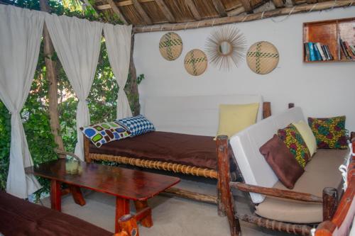 Postel nebo postele na pokoji v ubytování Mudi House