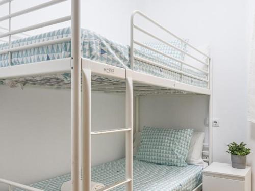 Ένα ή περισσότερα κρεβάτια σε δωμάτιο στο Algaba Málaga Casita