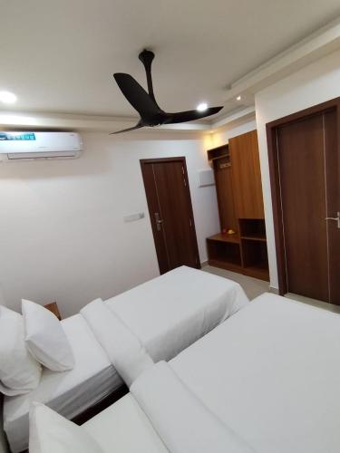 Postel nebo postele na pokoji v ubytování Handhuveli Dhangethi