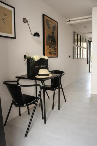 a table with a laptop on it in a room at Campo de Santa Clara 98 in Lisbon