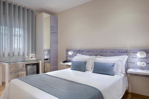 Postel nebo postele na pokoji v ubytování Hotel das Salinas by Alboi Group