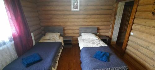 En eller flere senge i et værelse på Гукливчик