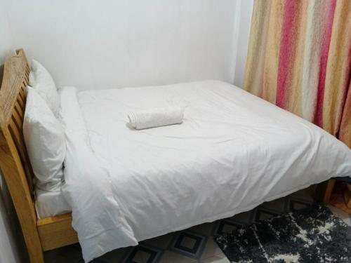 Postel nebo postele na pokoji v ubytování JASMINE BNBs