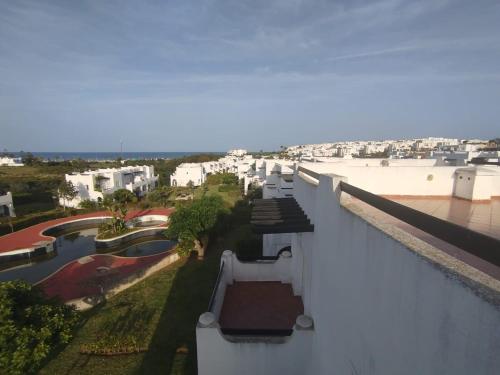 a view from the roof of a building with a pool at Super villa de haut standing in Dar Merah Deriba