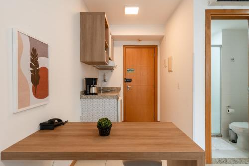 a kitchen with a wooden counter top in a room at BSB STAY Premium Flats Particulares - Saint Moritz in Brasilia