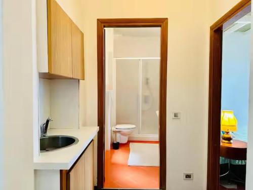 a bathroom with a sink and a toilet in it at Residenza Renata in Onno