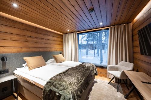 Postel nebo postele na pokoji v ubytování Wilderness Hotel Kieppi