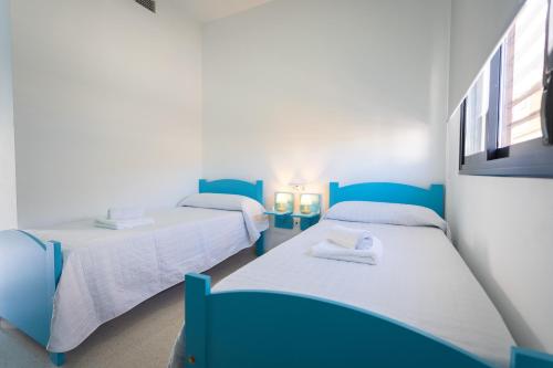 Ένα ή περισσότερα κρεβάτια σε δωμάτιο στο Hostal Las Viñas