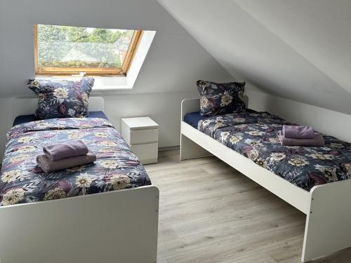 a bedroom with two beds and a window at Fully equipped Apartment in Castrop-Rauxel in Castrop-Rauxel