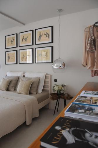a bedroom with a bed and a table with books at Campo de Santa Clara 98 in Lisbon