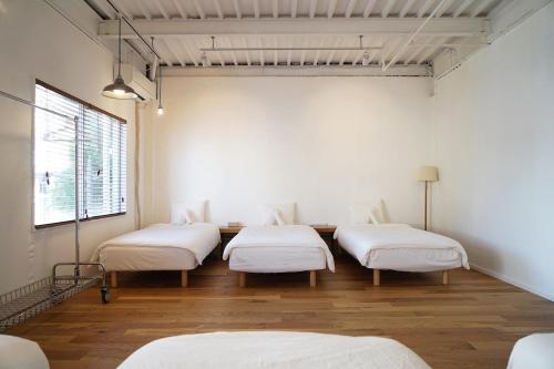 Postel nebo postele na pokoji v ubytování Kuri Apartment