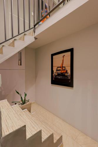 a living room with a tv on the wall at Hermoso LOFT en Guaduas in Guaduas