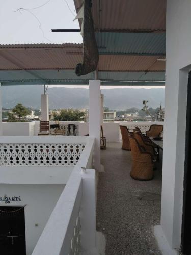 a view from the roof of a building with tables and chairs at Hotel Diamond Pushkar in Pushkar