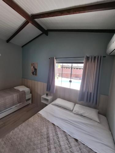 Postel nebo postele na pokoji v ubytování Recanto Carvalho - Suíte 8