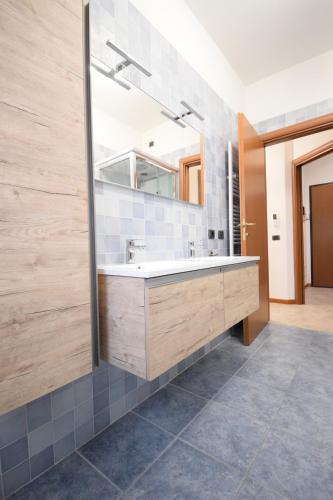 a bathroom with a sink and a mirror at La Casa di Dante Bologna in Sala Bolognese