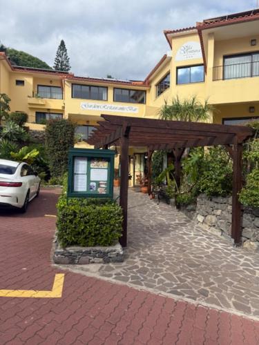 a building with a sign in front of it at Vila Ventura Village in Caniço