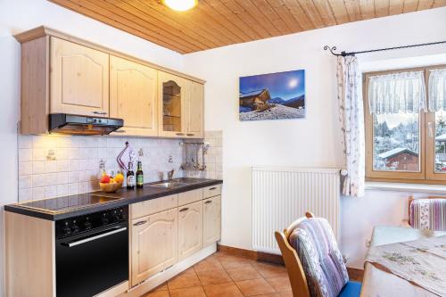 Kuchyň nebo kuchyňský kout v ubytování Ferienwohnung Alpspitze