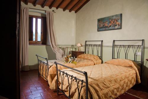 Giường trong phòng chung tại Florence Winery Country Apartments - Fattoria Lavacchio