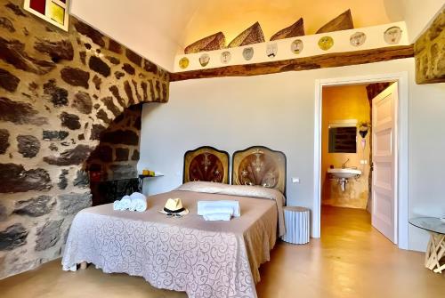 En eller flere senge i et værelse på Dammuso Civulia Pantelleria
