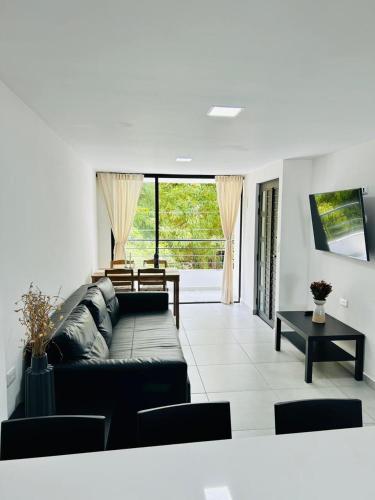 Et tv og/eller underholdning på Central apartment in Bello