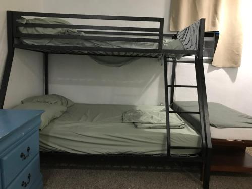 a bunk bed in a room with a bunk bedutenewayangering at PalmBeachDowntownPrivatHouseShare99perpersonupto5Party in West Palm Beach