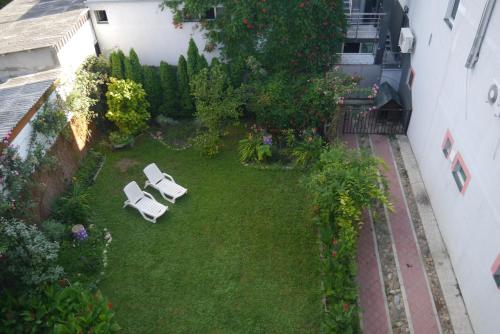 an aerial view of a garden with two lawn chairs at Guest House Villa Lord in Novi Sad