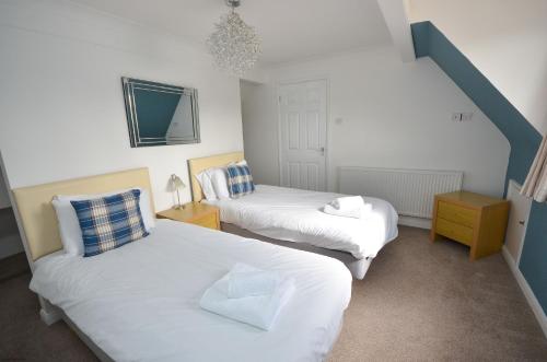 En eller flere senge i et værelse på Broadwater on the river in Wroxham