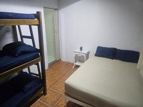 Ένα ή περισσότερα κρεβάτια σε δωμάτιο στο Hostel Sol do Alcaíra