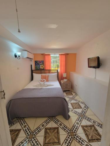 Ένα ή περισσότερα κρεβάτια σε δωμάτιο στο Casa De Amor Suites