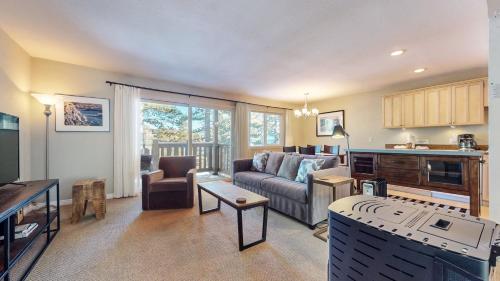 a living room with a couch and a table at Western Slopes Villas #7 condo in Mammoth Lakes