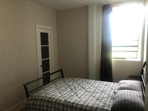 Ένα ή περισσότερα κρεβάτια σε δωμάτιο στο Le Loft des Milles-Îles