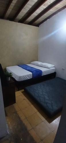 a room with two beds in a room with at Montanha in San Rafael