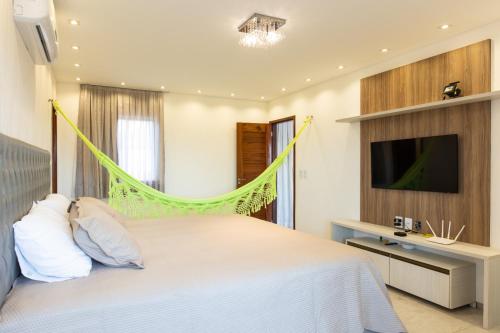 Giường trong phòng chung tại Casa Porpora Cumbuco