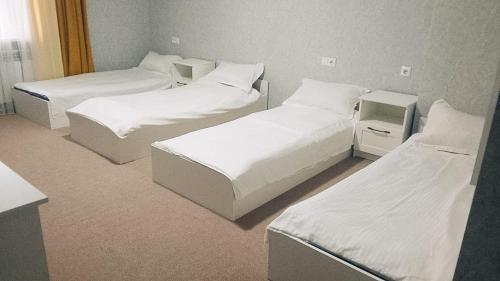 Een bed of bedden in een kamer bij Halqyma