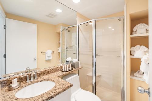 a bathroom with a sink and a shower at Inn at the Beach-Venice FLORIDA in Venice