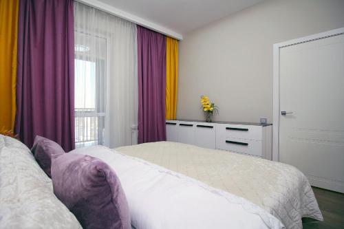 En eller flere senge i et værelse på Lavender Raf