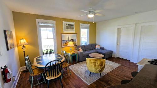 a living room with a couch and a table at The Monarch - 4 Butternut in Cherry Valley