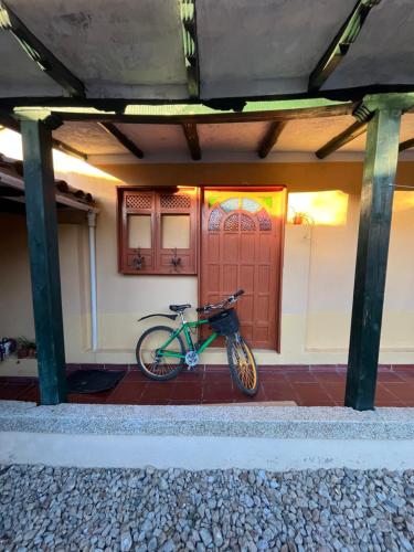 a bike parked in front of a house at Hotel Santa Lucia de Cucaita in Cucaita