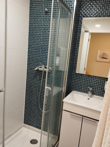 a bathroom with a shower and a sink at Pátio Da Gata in Coimbra